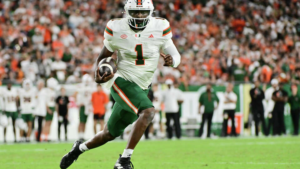 Miami's Cam Ward runs against South Florida.