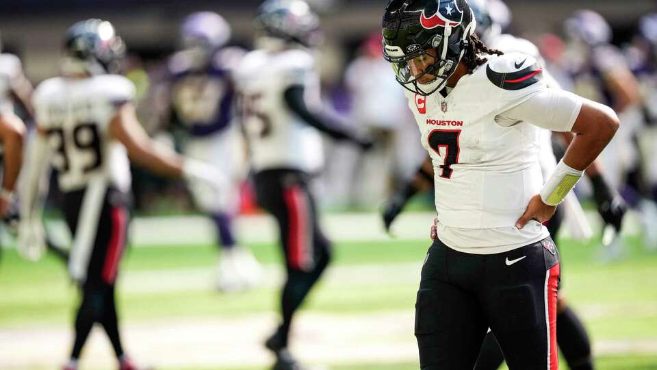 Houston Texans quarterback C.J. Stroud (7) walks off the field after he was sacked by Minnesota Vikings linebacker Jonathan Greenard and the Texans turned the ball over on downs during the second half of an NFL football game Sunday, Sept. 22, 2024, in Minneapolis, Minn.