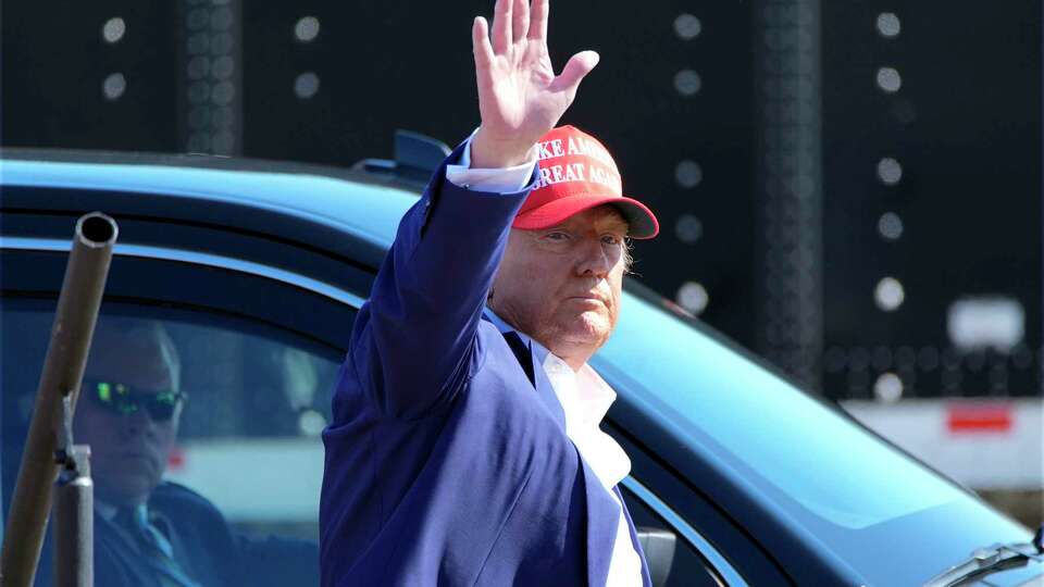 Republican presidential nominee former President Donald Trump waves after speaking at a campaign rally at Wilmington International Airport, Saturday, Sept. 21, 2024, in Wilmington, N.C.