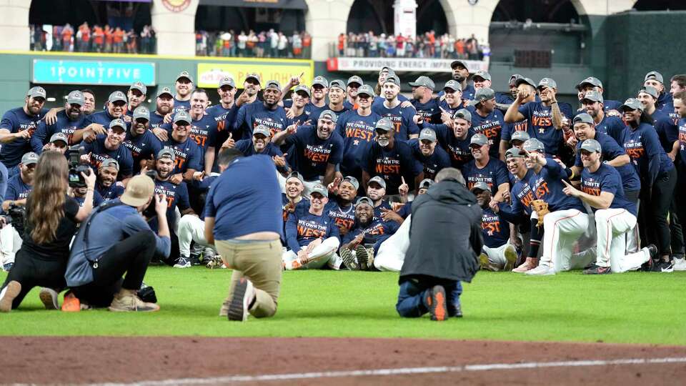 Houston Astros group photo as they celebrated after winning the American League West title after beating the Seattle Mariners 4-3 after an MLB baseball game at Minute Maid Park on Tuesday, Sept. 24, 2024, in Houston.