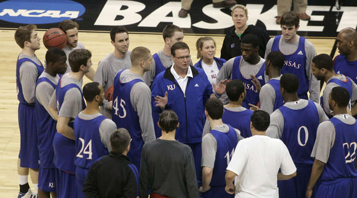 Kansas guard Chase Buford (far left), a junior walk-on from Alamo Heights, and his teammates listen to coach Bill Self (center) before their first-round victory over Lehigh. However, the top-seeded Jayhawks didn't survive Oklahoma City, losing to Northern Iowa in the second round.