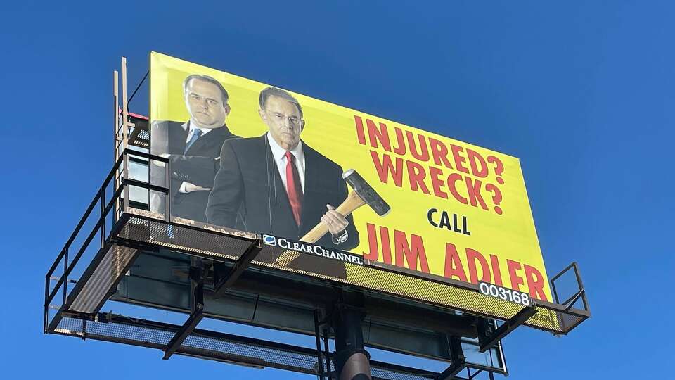 A Jim Adler & Associates billboard on San Antonio's East Side. Jim Adler, holding the sledgehammer, has gone by the 'Texas Hammer' moniker for decades.