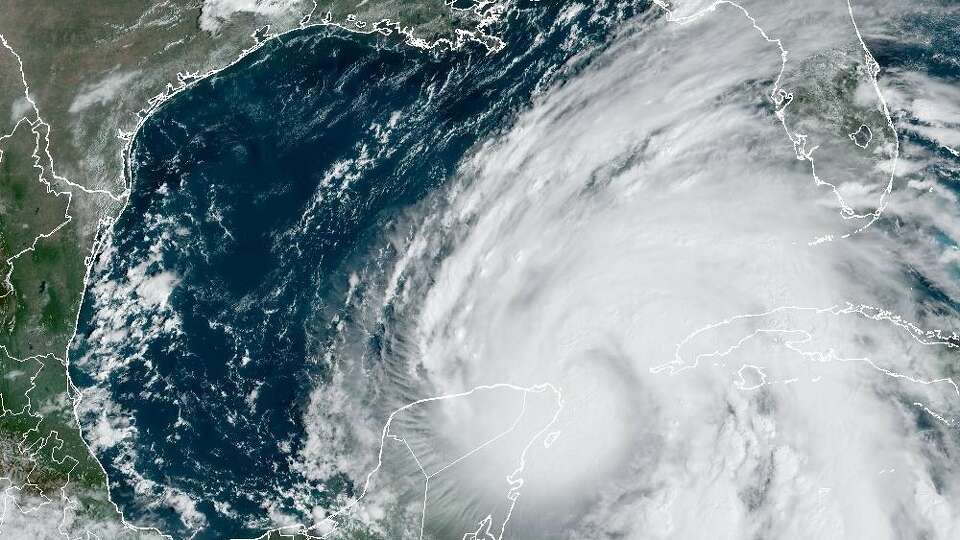 In this weather satellite photo taken Wednesday morning, Hurricane Helene was on the doorstep of the Gulf of Mexico, where it was expected to strengthen into a major hurricane in the next 24 hours.