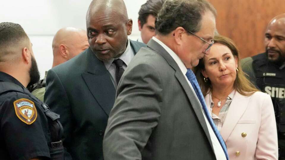 Former Houston police officer Gerald Goines with his defense attorneys Reagan Wynn and Nicole DeBorde Hochglaube stand in the 482nd District Court at the Harris County Criminal courthouse after he was found guilty Wednesday, Sept. 25, 2024, in Houston. Goines was found guilty of felony murder in the 2019 deaths of Dennis Tuttle and Rhogena Nicholas.