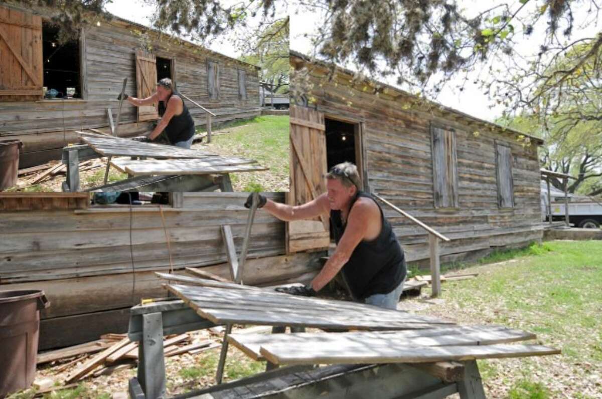 Carpenter Delmis Shields works on preserving the Sisterdale Dance Hall and Community Center.