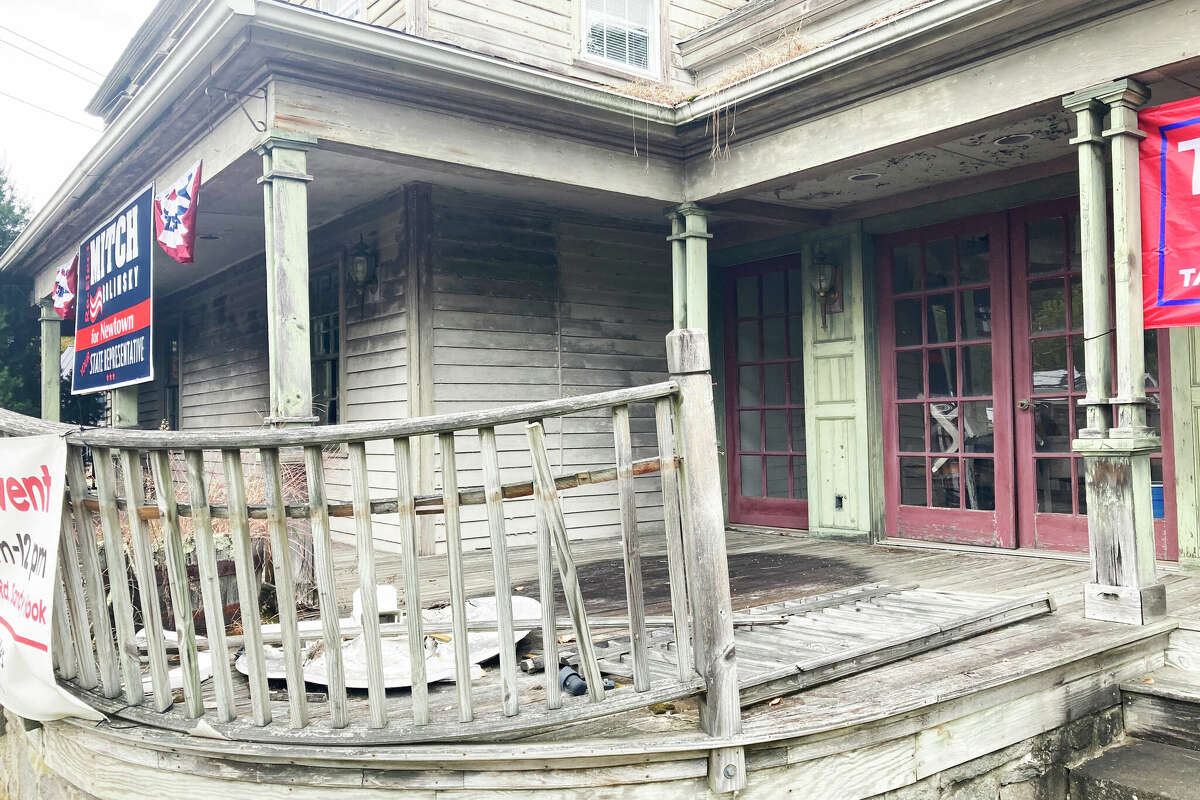 A blighted structure at 2 Riverside Road in Sandy Hook center, part of a proposed redevelopment of homes and retail by a Bethel developer. Sept 25, 2024.