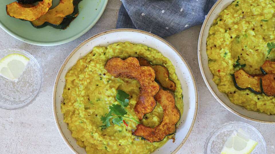 Hearty khichdi with roasted acorn squash is like a warm hug in a bowl