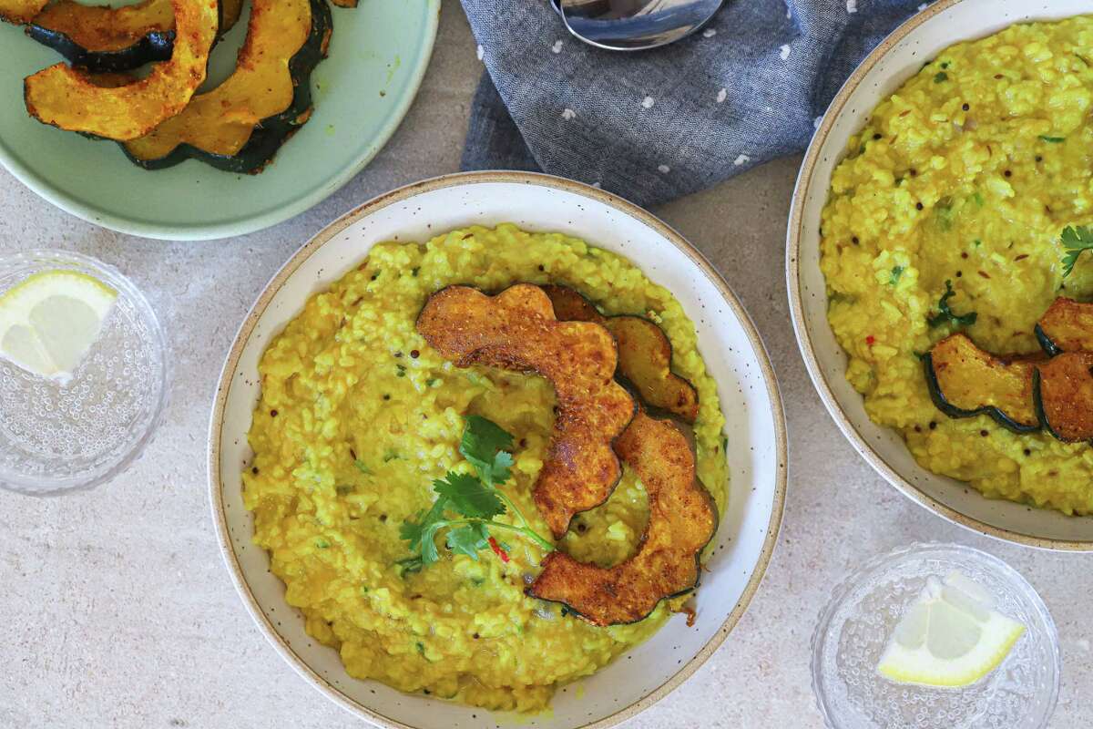 Hearty khichdi with roasted acorn squash is like a warm hug in a bowl