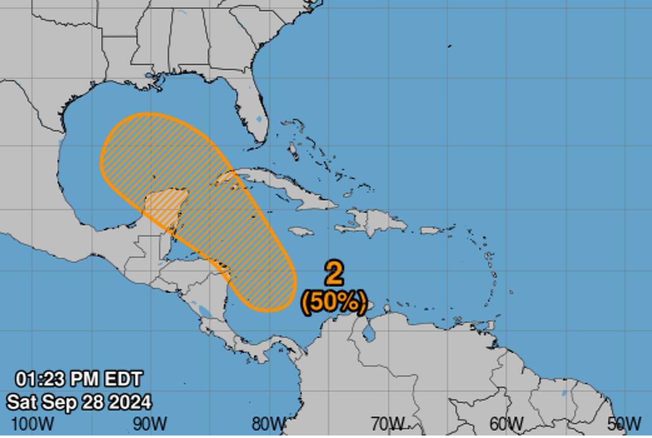 A tropical disturbance that is straddling the western Caribbean Sea and the Gulf of Mexico has a 50% chance of forming a tropical cyclone in the next seven days, according to the National Hurricane Center.