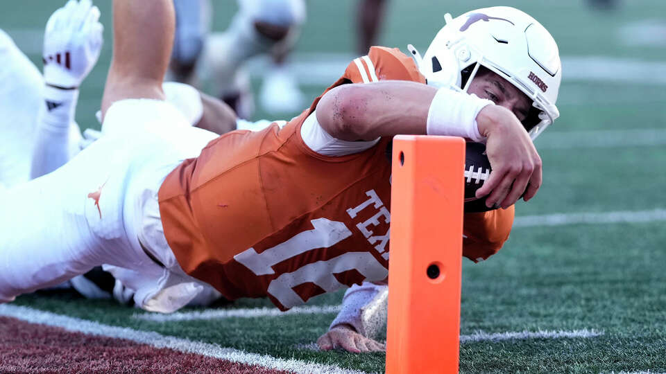 Texas quarterback Arch Manning dives just short of the goal line on a run during the second half of an NCAA college football game against Mississippi State in Austin, Texas, Saturday, Sept. 28, 2024. (AP Photo/Eric Gay)