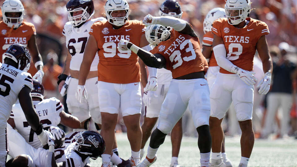 Texas linebacker David Gbenda (33) celebrates after a stop during the first half of an NCAA college football game against Mississippi State in Austin, Texas, Saturday, Sept. 28, 2024. (AP Photo/Eric Gay)