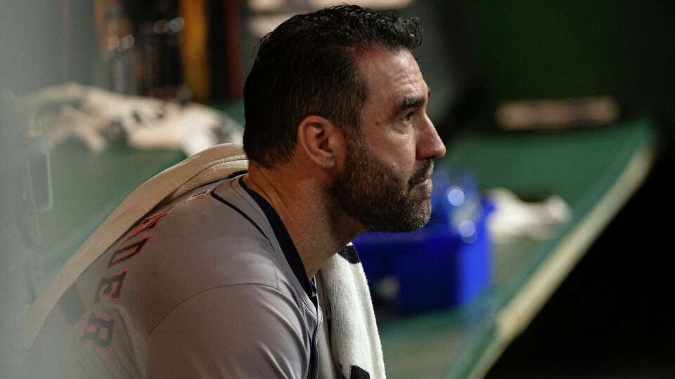 Houston Astros starting pitcher Justin Verlander sits in the dugout during the fifth inning of a baseball game against the Cleveland Guardians in Cleveland, Saturday, Sept. 28, 2024. (AP Photo/Phil Long)