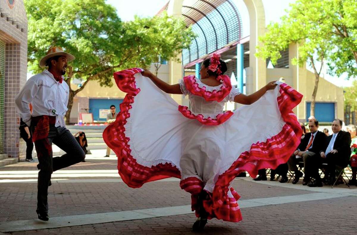 Carolina Guerra and Alvaro Duarte, dancers with the Compania Guadalupe, dance during the Cinco de Mayo celebration in Plaza Guadalupe on Wednesday.