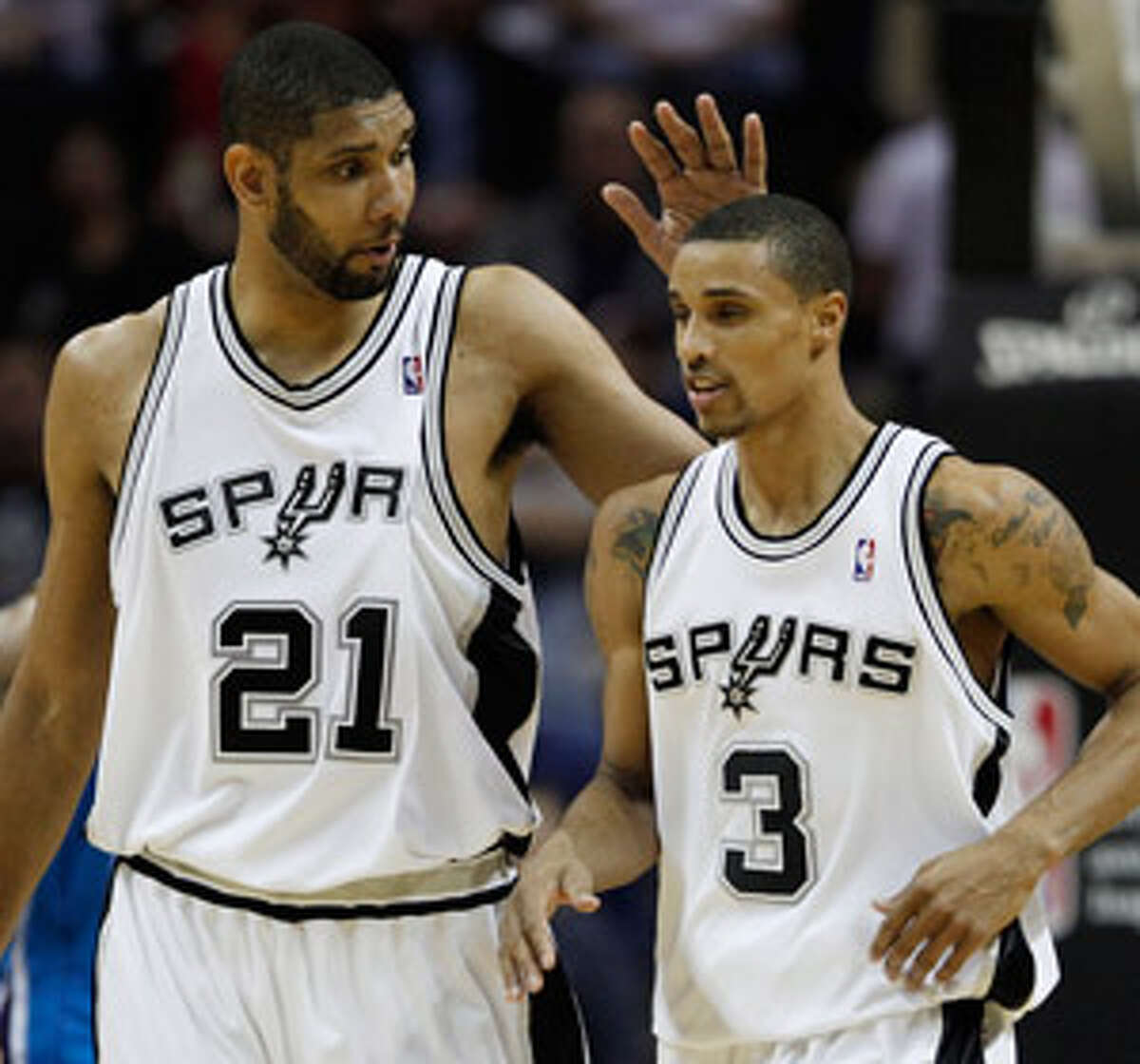 Tim Duncan (left) has seen George Hill thrive in his second season. The guard is averaging 16.2 points in 26 starts, but the bench is now without him and Manu Ginobili.