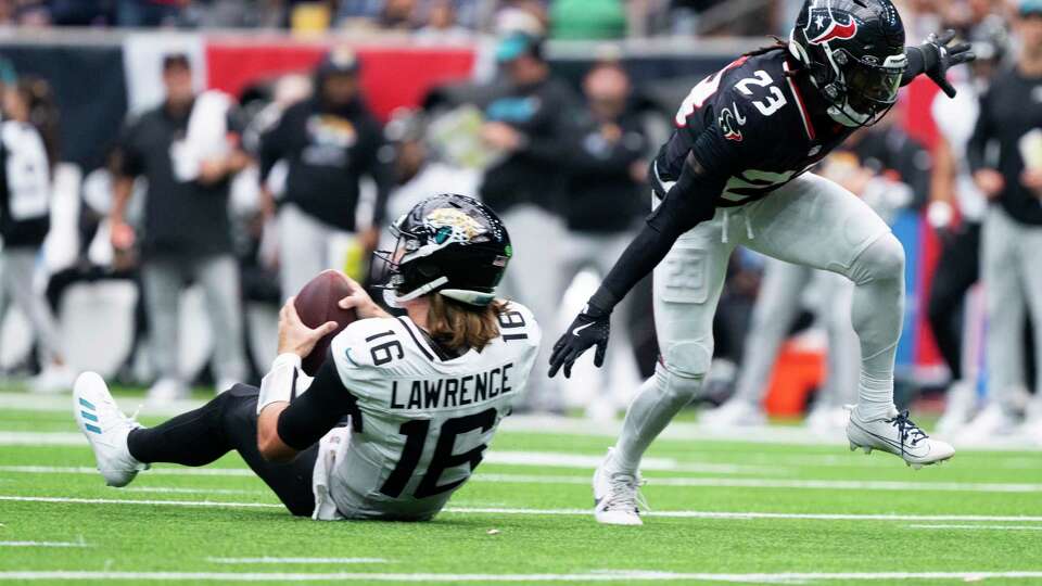 Houston Texans safety Eric Murray (23) reacts after sacking Jacksonville Jaguars quarterback Trevor Lawrence (16) during the second half of an NFL football game Sunday, Sept. 29, 2024, in Houston.