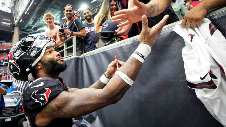 Houston Texans wide receiver Nico Collins (12) interacts with the fans after the Texans 24-20 win over the Jacksonville Jaguars in an NFL football game Sunday, Sept. 29, 2024, in Houston.