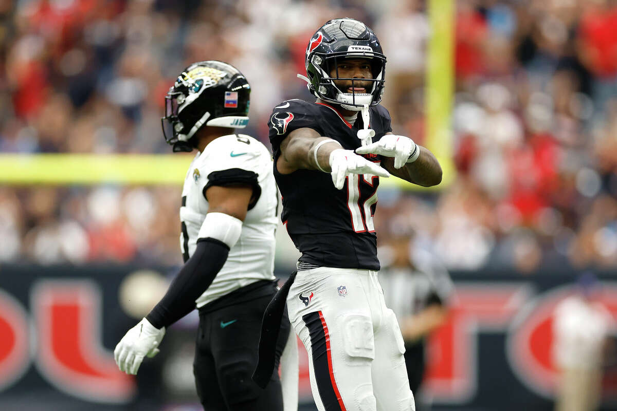 HOUSTON, TEXAS - SEPTEMBER 29: Nico Collins #12 of the Houston Texans celebrates a first down against the Jacksonville Jaguars during the fourth quarter of the game at NRG Stadium on September 29, 2024 in Houston, Texas. (Photo by Tim Warner/Getty Images)