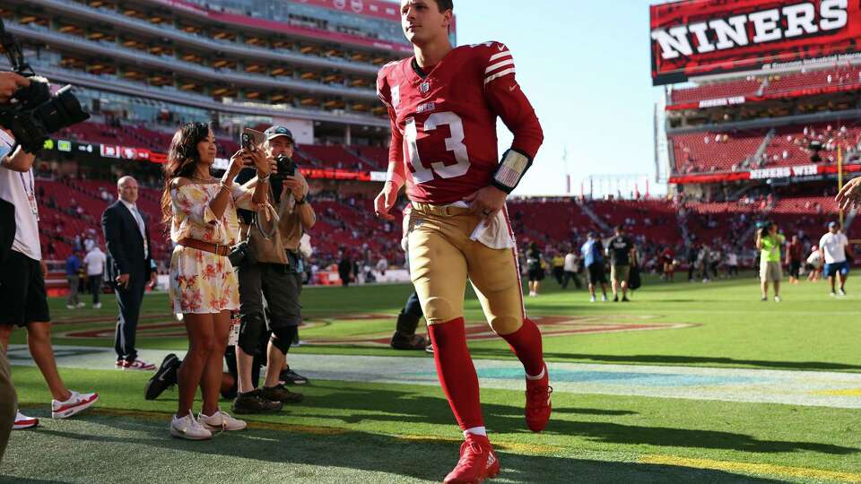 San Francisco 49ers’ Brock Purdy runs off the field after Niners’ 30-13 win over New England Patriots during NFL game at Levi’s Stadium in Santa Clara, Calif., on Sunday, September 29, 2024.