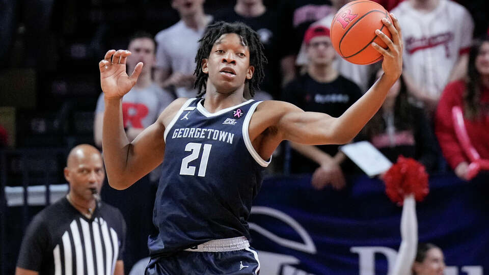 Ryan Mutombo, shown here grabbing a rebound for Georgetown in a 2023 game, posted a moving tribute to his father Dikembe Mutomobo on Monday.