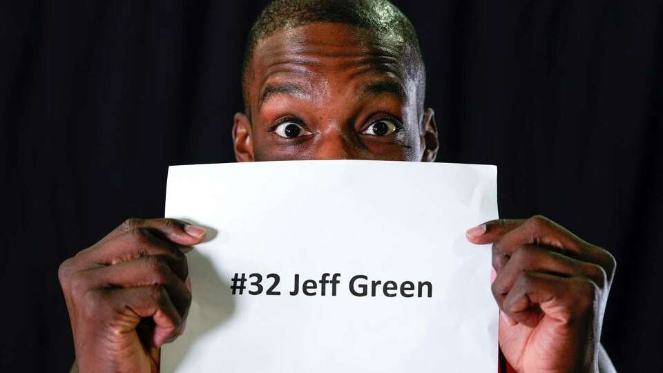 Houston Rockets Jeff Green holds up a name identification tag before posing for a portrait during Rockets Media Day at Toyota Center on Monday, Sept. 30, 2024 in Houston.