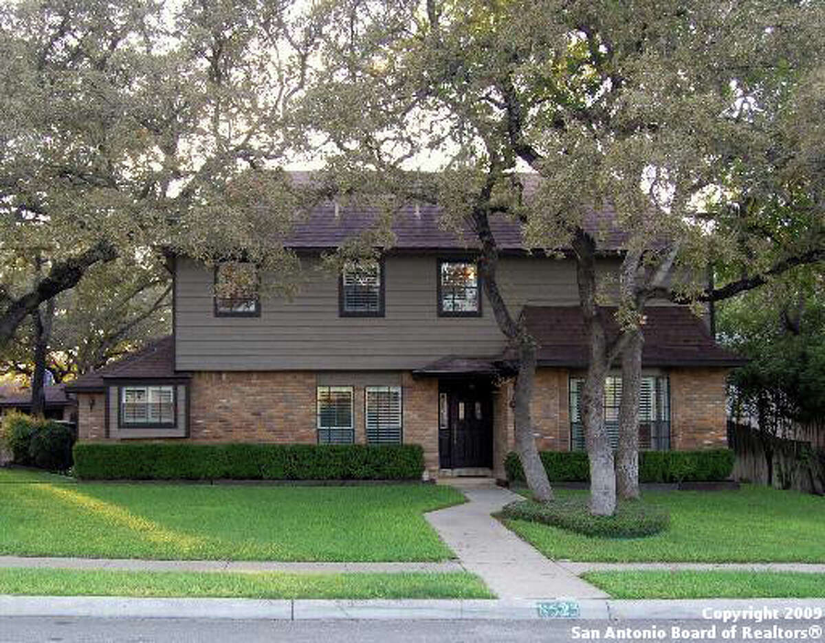 Mature trees flank Olympia Hills home