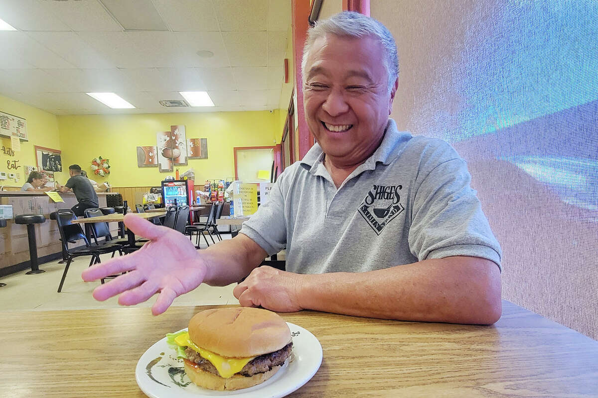 Shige's Saimin Stand owner Ross Shigeoka with the cheeseburger that won best in the nation.