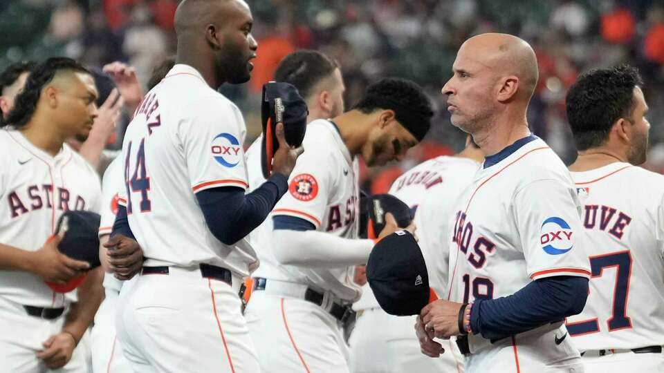 Houston Astros designated hitter Yordan Alvarez talks with manager Joe Espada before Game 1 of the American League Wild Card Series at Minute Maid Park, Tuesday, Oct. 1, 2024, in Houston.