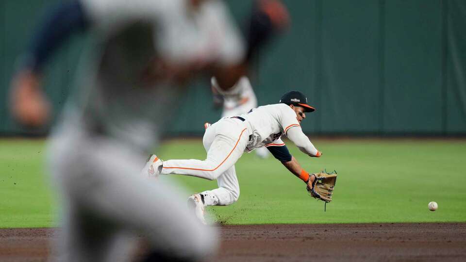 Houston Astros shortstop Jeremy Peña (3) tries to field an RBI single by Detroit Tigers Jake Rogers in second inning during Game 1 of the American League Wild Card Series at Minute Maid Park, Tuesday, Oct. 1, 2024, in Houston.