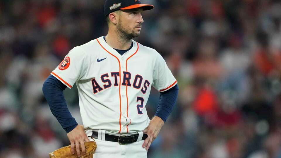 Houston Astros third baseman Alex Bregman (2) watches the replay after Detroit Tigers Wenceel Pérez is ruled safe by second base umpire Will Little in front of Houston Astros shortstop Jeremy Peña to steal second in the seventh inning during Game 1 of the American League Wild Card Series at Minute Maid Park, Tuesday, Oct. 1, 2024, in Houston.