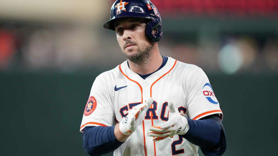 Houston Astros Alex Bregman (2) reacts after hitting a single in the ninth inning during Game 1 of the American League Wild Card Series at Minute Maid Park, Tuesday, Oct. 1, 2024, in Houston.