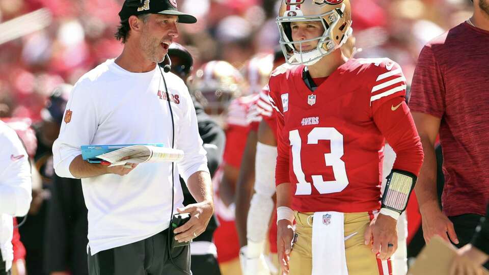 San Francisco 49ers’ head coach Kyle Shanahan talks with Brock Purdy in 1st quarter during Niners’ 30-13 win over New England Patriots during NFL game at Levi’s Stadium in Santa Clara, Calif., on Sunday, September 29, 2024.