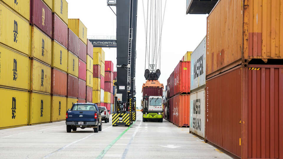 A container is loaded onto a truck by a crane at the Port Houston Bayport Container Terminal on Tuesday, May 7, 2024, in Pasadena.