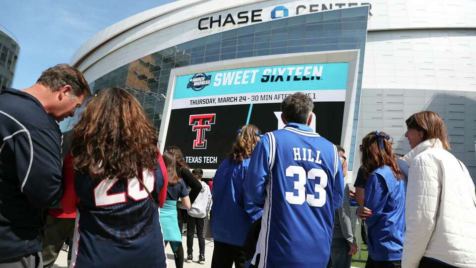 Gonzaga and Duke fans wait to enter Chase Center before NCAA Men's Basketball West Regional semifinal in San Francisco, Calif., on Thursday, March 24, 2022.