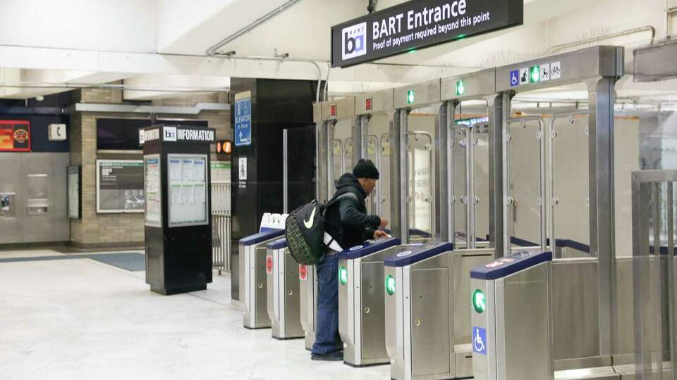 A BART patron uses the new hardened fare gates BART recently installed at San Francisco's Civic Center Station on Friday, August 2, 2024 in San Francisco, Calif.