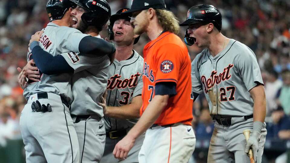 Houston Astros pitcher Josh Hader, center, walks back to the mound as Detroit Tigers Spencer Torkelson, center, is embraced by Colt Keith and Matt Vierling after scoring on Andy Ibanez’s 3-run, pinch-hit double off to take a 5-2 lead in the eighth inning during Game 2 of the American League Wild Card Series at Minute Maid Park, Wednesday, Oct. 2, 2024, in Houston.