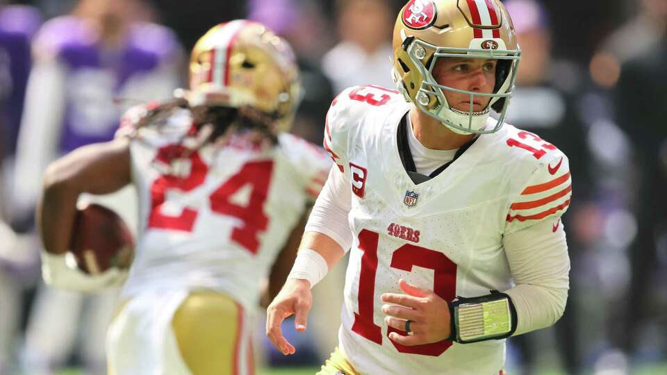 MINNEAPOLIS, MINNESOTA - SEPTEMBER 15: Brock Purdy #13 of the San Francisco 49ers hands off the ball to Jordan Mason #24 against the Minnesota Vikings during the third quarter at U.S. Bank Stadium on September 15, 2024 in Minneapolis, Minnesota.