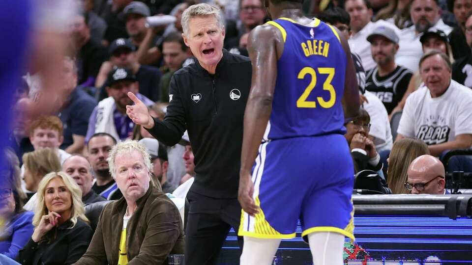 Golden State Warriors’ head coach Steve Kerr interacts with Draymond Green in 3rd quarter against Sacramento Kings in NBA Play-in Game at Golden 1 Center in Sacramento on Tuesday, April 16, 2024.