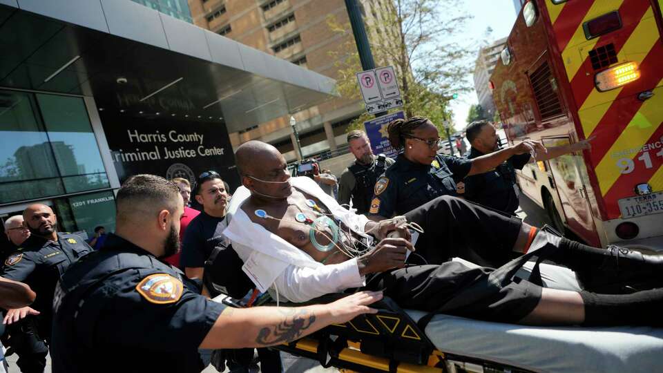 Former Houston police officer Gerald Goines is taking to an ambulance after having a medical emergency in the 482nd District Court at the Harris County Criminal courthouse during the punishment phase of his felony murder trial Thursday, Oct. 3, 2024, in Houston. Goines was found guilty of felony murder in the 2019 deaths of Dennis Tuttle and Rhogena Nicholas. Thursday, Oct. 3, 2024, in Houston.