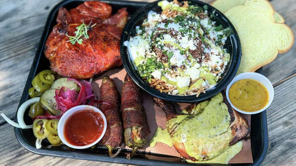 Glazed pork chop, loaded fideo, pesto chicken and boudin-stuffed bacon-wrapped jalapenos at Rosemeyer Bar-B-Q, Spring