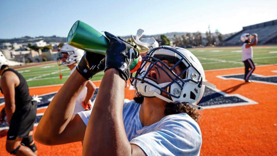 Sammy Johnson, a receiver and cornerback, takes a drink of water during football practice at Balboa High School San Francisco, on Wednesday, Oct. 2, 2024.