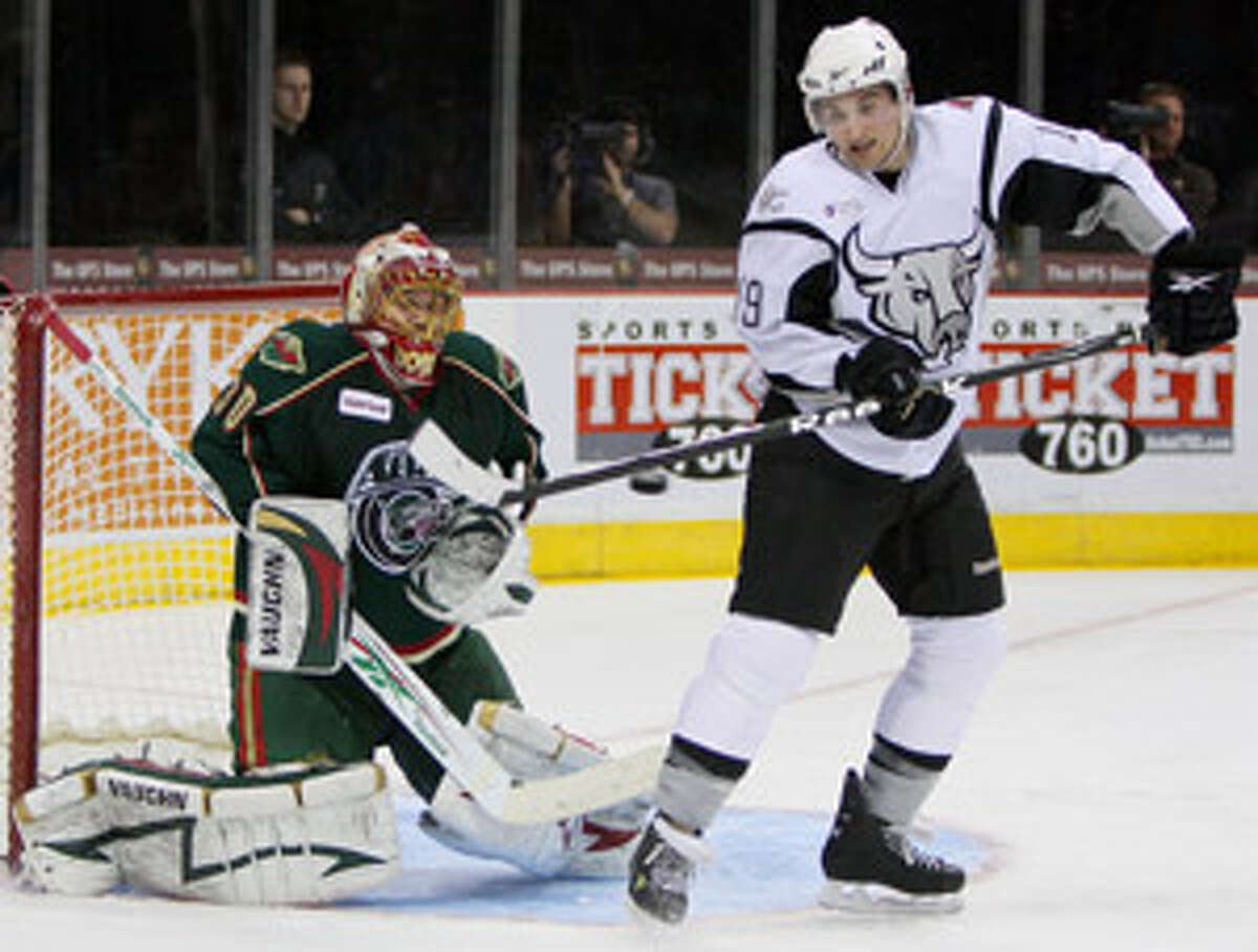 The Rampage's Brett MacLean tries to deflect a shot past Houston Aeros goalie Anton Khudobin during the second period Wednesday night at the AT&T Center.