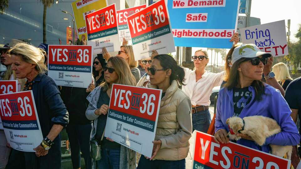 Neighbors and business owners join to support California's Proposition 36 on the November ballot at a news conference in the Venice neighborhood of Los Angeles on Monday, Sept. 30, 2024. (AP Photo/Damian Dovarganes)