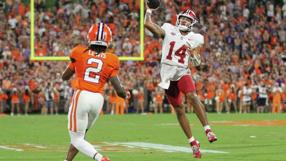 Stanford quarterback Ashton Daniels (14) throws a pass over Clemson cornerback Shelton Lewis (2) during the first half of an NCAA college football game Saturday, Sept. 28, 2024, in Clemson, S.C. (AP Photo/Artie Walker Jr.)