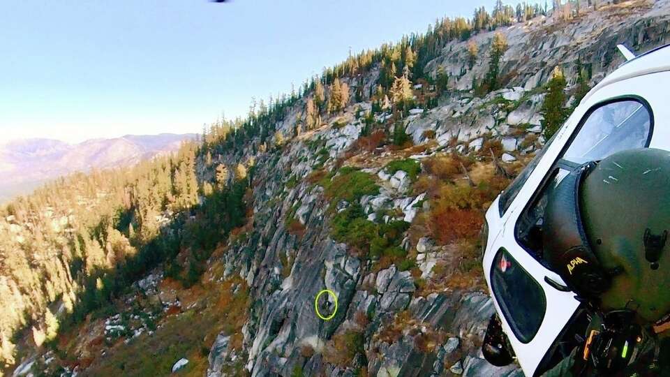 Video released by the El Dorado County Sheriff’s Department on Thursday captures the moment when the team saved the unnamed man who had veered off the path and found himself trapped on a steep granite bluff overlooking Angora Lakes.