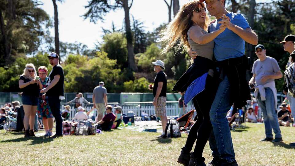 Jeanne Simon of Walnut Creek and Bill Purdy of Lafayette dance to the music of Hot Buttered Rum at the Banjo Stage during the Hardly Strictly Bluegrass Festival held at Golden Gate Park in San Francisco, Calif. Saturday, Oct. 5, 2019.