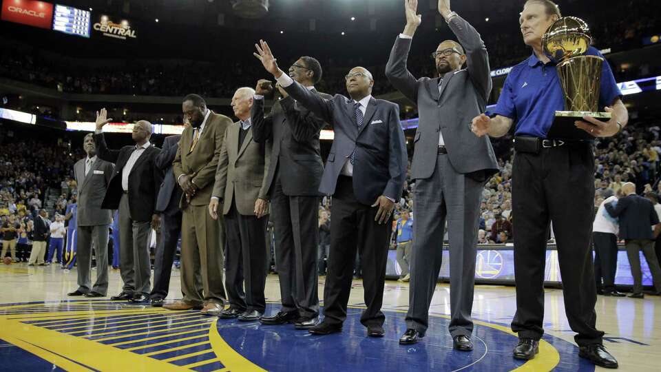 The 1975 Warriors championship team is recognized for their 40th anniversary during the first half of the Golden State Warriors game against the Washington Wizards at Oracle Arena in Oakland, Calif, on Monday, March 23, 2015.