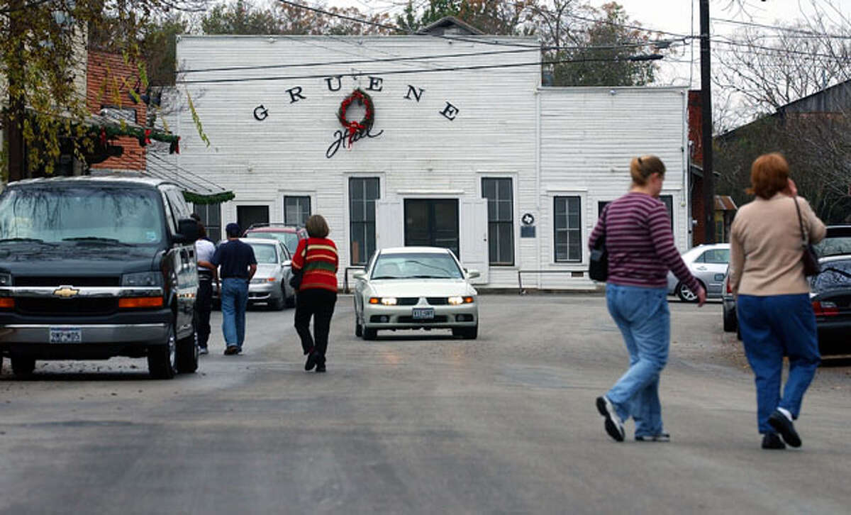 Shoppers walk the streets of Gruene Dec. 26, 2003. The historic area, anchored by Gruene Hall, has been growing since the late '70's yet has had to change little to accommodate the increased tourism.
