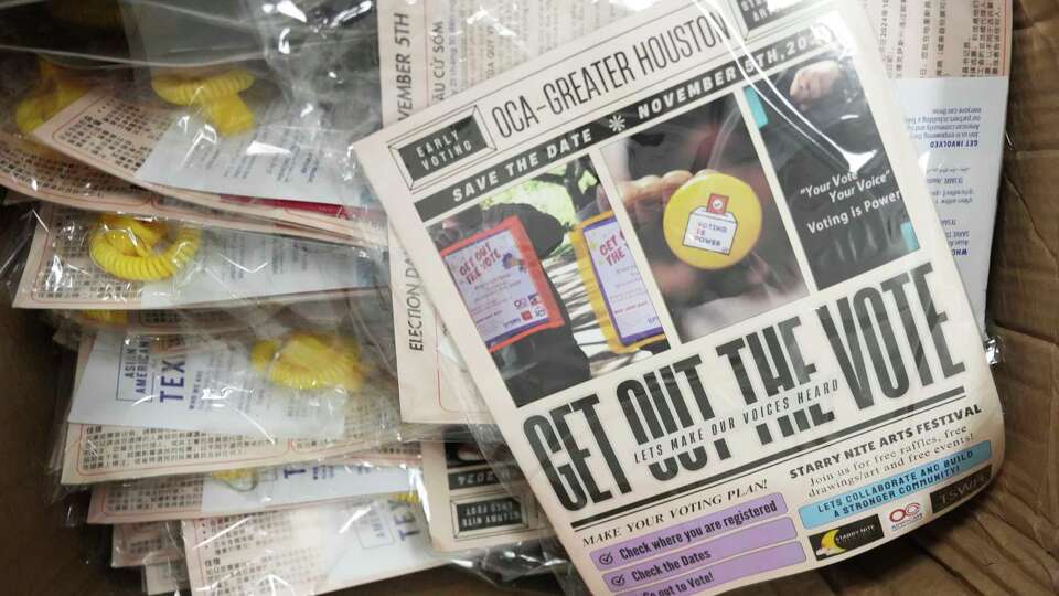 Voting and election literature is seen for volunteers to distribute through neighborhoods in Fort Bend County to increase voter turnout among the Asian American community, Friday, Sept. 26, 2024.