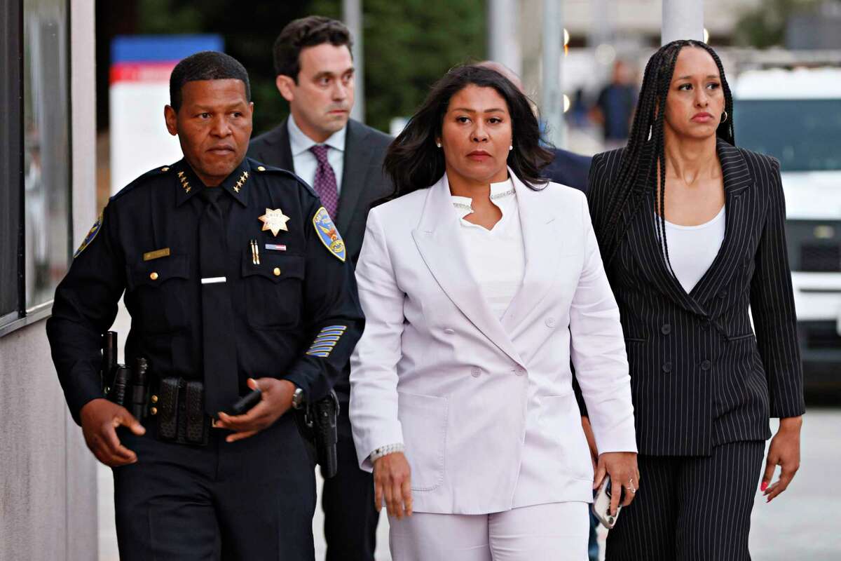 From left: Police chief Bill Scott, police strategic communications director Evan Sernoffsky, Mayor London Breed and District Attorney Brooke Jenkins walk towards members of the news media for a news conference at Zuckerberg San Francisco General Hospital and Trauma Center on Saturday, Aug. 31, 2024. Ricky Pearsall, a player with the San Francisco 49ers, was shot late Saturday afternoon in a robbery in Union Square. Pearsall was rushed to General Hospital, where he was being treated for his injuries and was expected to survive. The robbery suspect was immediately apprehended and arrested by police.