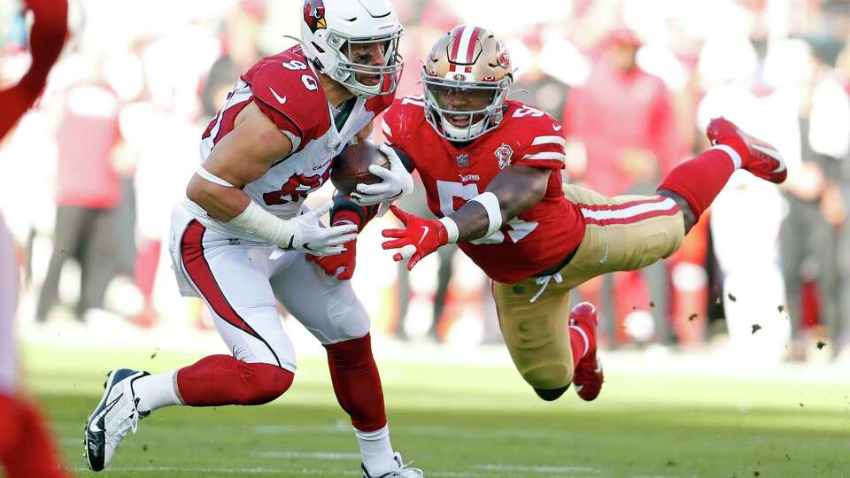 San Francisco 49ers' Azeez Al-Shaair can't tackle Arizona Cardinals' Zach Ertz in 2nd quarter during NFL game at Levi's Stadium in Santa Clara, Calif., on Sunday, November 7, 2021.